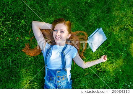 Beautiful smiling red-haired young woman 29084313