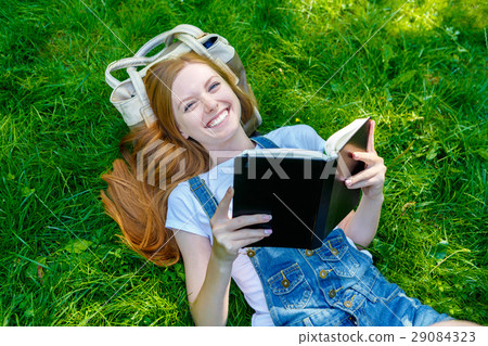 Beautiful smiling red-haired young woman 29084323