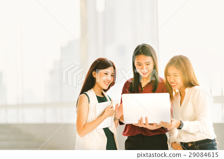 Asian girls on casual business meeting with laptop 29084615