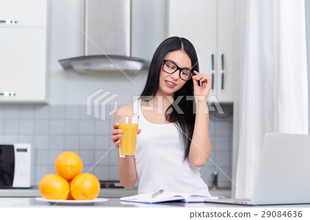 Successfully woman in eyeglasses reading and 29084636