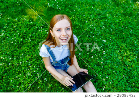 Beautiful smiling red-haired young woman Beautiful smiling red-haired young woman 29085452