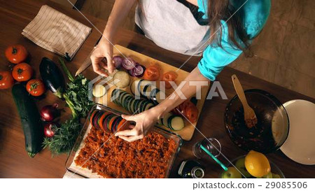 Young woman cooking homemade ratatouille Young woman cooking homemade ratatouille 29085506