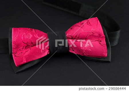 Purple bow tie on black background Purple bow tie on black background 29086444