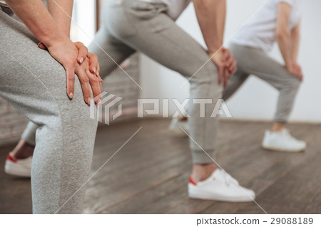 Close up of female hands being on the knee 29088189
