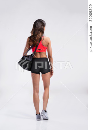 Fitness woman in sports bra and shorts, rear view 29089209