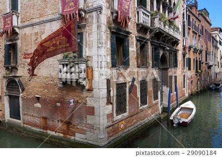 Venice famous narrow canal view with brick walls Venice famous narrow canal view with brick walls 29090184