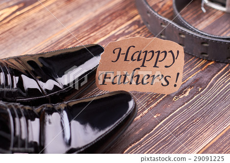 Black footwear and leather belt. Black footwear and leather belt. 29091225
