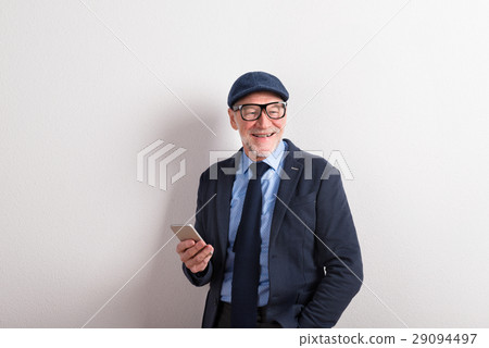 Senior man in blue shirt, jacket, eyeglasses and Senior man in blue shirt, jacket, eyeglasses and 29094497