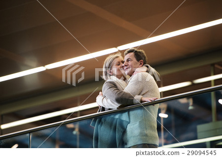 Senior couple standing at the train station 29094545