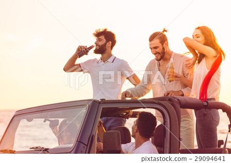 Five young people having fun in convertible car at Five young people having fun in convertible car at 29094641