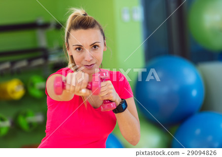 portrait of pretty sporty girl holding weights 29094826