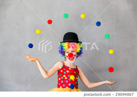 Funny kid clown playing indoor Funny kid clown playing indoor 29094867