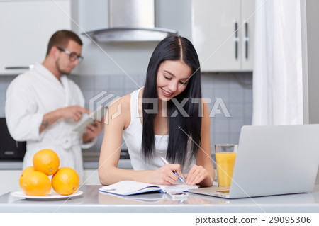 Couple using gadgets and planning day. 29095306