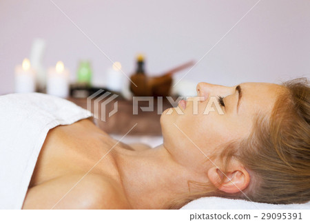Portrait of a young woman getting spa treatment Portrait of a young woman getting spa treatment 29095391