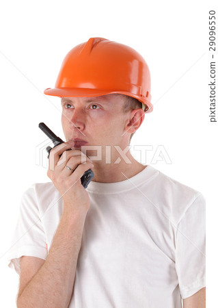 builder talking on portable UHF radio transceiver 29096550