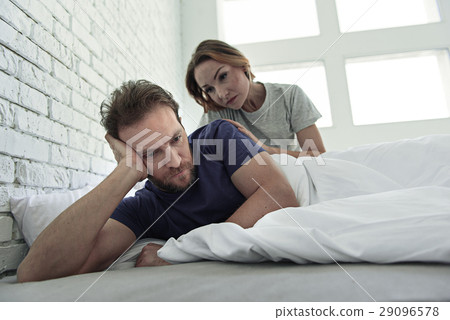 Upset couple lying in bed Upset couple lying in bed 29096578