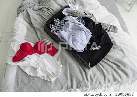 Open bag with different clothes Open bag with different clothes 29096638