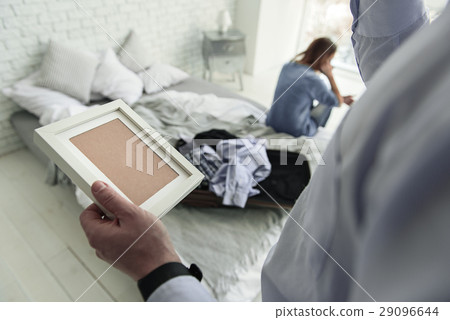 Male person holding empty frame Male person holding empty frame 29096644