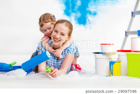 Repair in apartment. Happy family mother and child daughter pain Repair in apartment. Happy family mother and child daughter pain 29097596