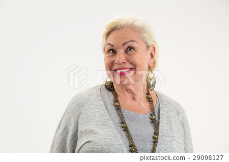 Isolated elderly female smiling. 29098127