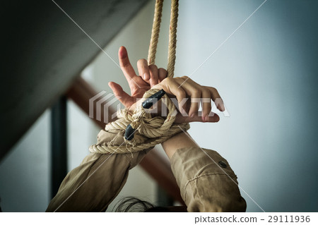 Human Hands Tied Up Together With Rope Stock Photo