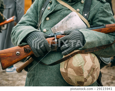Soldier winter uniform with a rifle in his hands 29115941