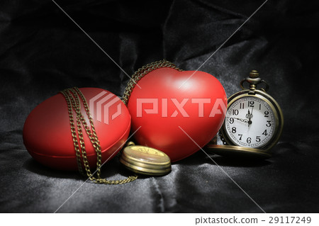 vintage clock and red heart on black background , 29117249