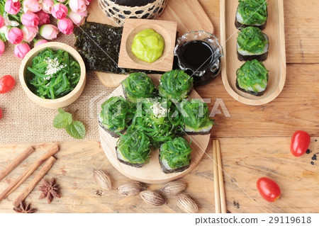 Sushi roll and seaweed salad is delicious. Sushi roll and seaweed salad is delicious. 29119618