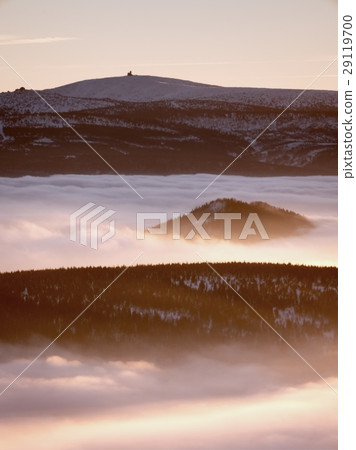 Inverse weather in mountains, shinning fog. 29119700