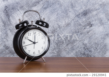 4 o'clock vintage clock on wood table and wall 4 o'clock vintage clock on wood table and wall 29120941