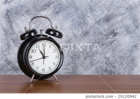 4 o'clock vintage clock on wood table and wall 4 o'clock vintage clock on wood table and wall 29120942