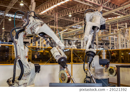 Team robot are welding automotive part in factory 29121392