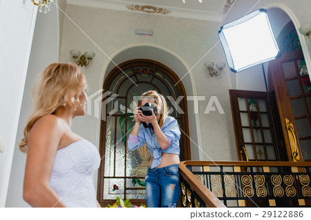 Photographer is shooting portrait of the bride 29122886