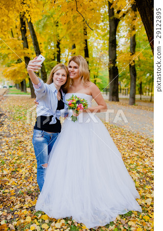 Photographer shooting a selfie with the bride 29122895
