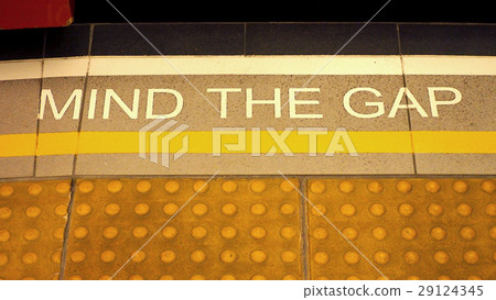 Mind the gap sign on the subway train platform. Mind the gap sign on the subway train platform. 29124345