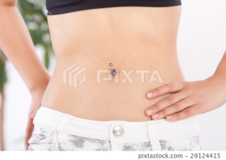 A woman who is anxious about the abdomen 29124415