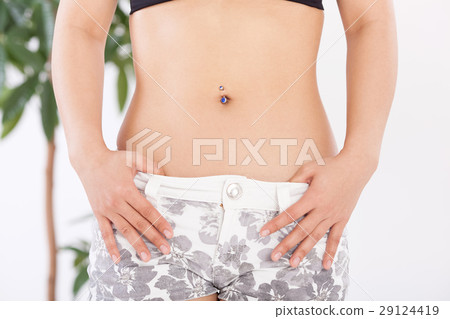 A woman who is anxious about the abdomen A woman who is anxious about the abdomen 29124419