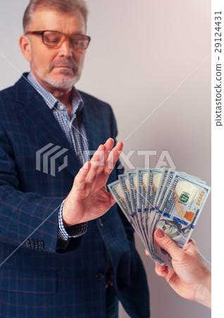 Senior man rejecting bribe from partner Senior man rejecting bribe from partner 29124431