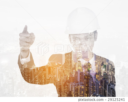 Double exposure of engineer with helmet against city Double exposure of engineer with helmet against city 29125241