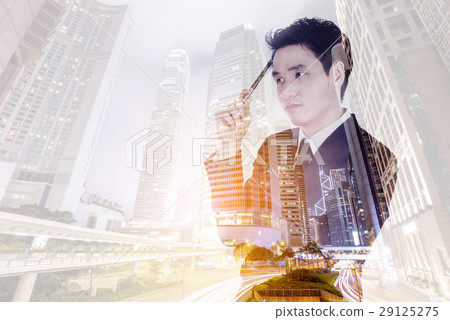 Double exposure of  business man thinking against city 29125275