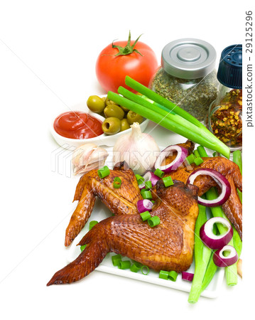 smoked chicken wings and vegetables on a white smoked chicken wings and vegetables on a white 29125296