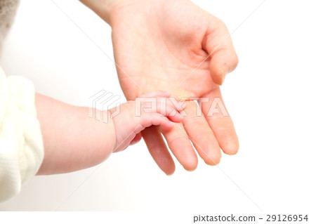 Mother touching infant hands Hand 29126954