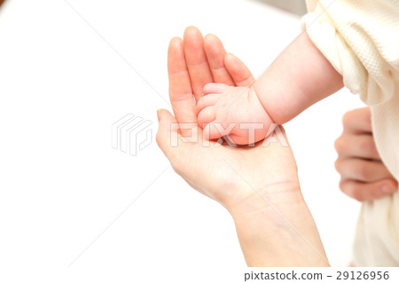 Mother touching infant hands Hand 29126956