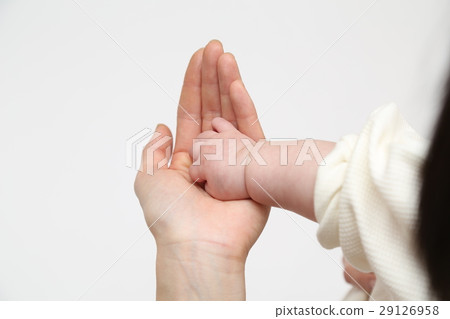 Mother touching infant hands Hand 29126958