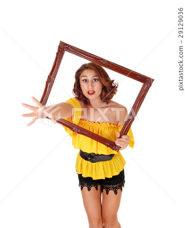 Woman stretching hand trough frame. Woman stretching hand trough frame. 29129036