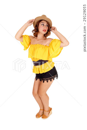 Woman posing in shorts and hat. Woman posing in shorts and hat. 29129055