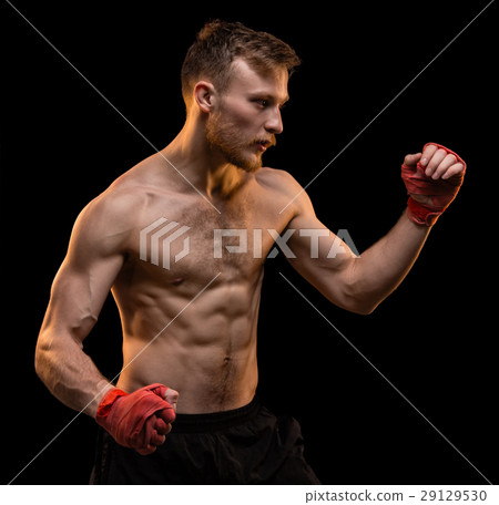 Young man during boxing training Young man during boxing training 29129530