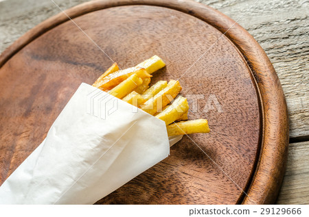 French fries in a paper wrapper 29129666