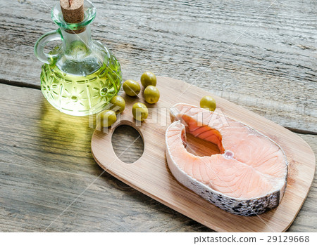 Food with unsaturated fats - salmon and olive oil Food with unsaturated fats - salmon and olive oil 29129668