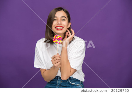 The young woman with colorful lollipop The young woman with colorful lollipop 29129760